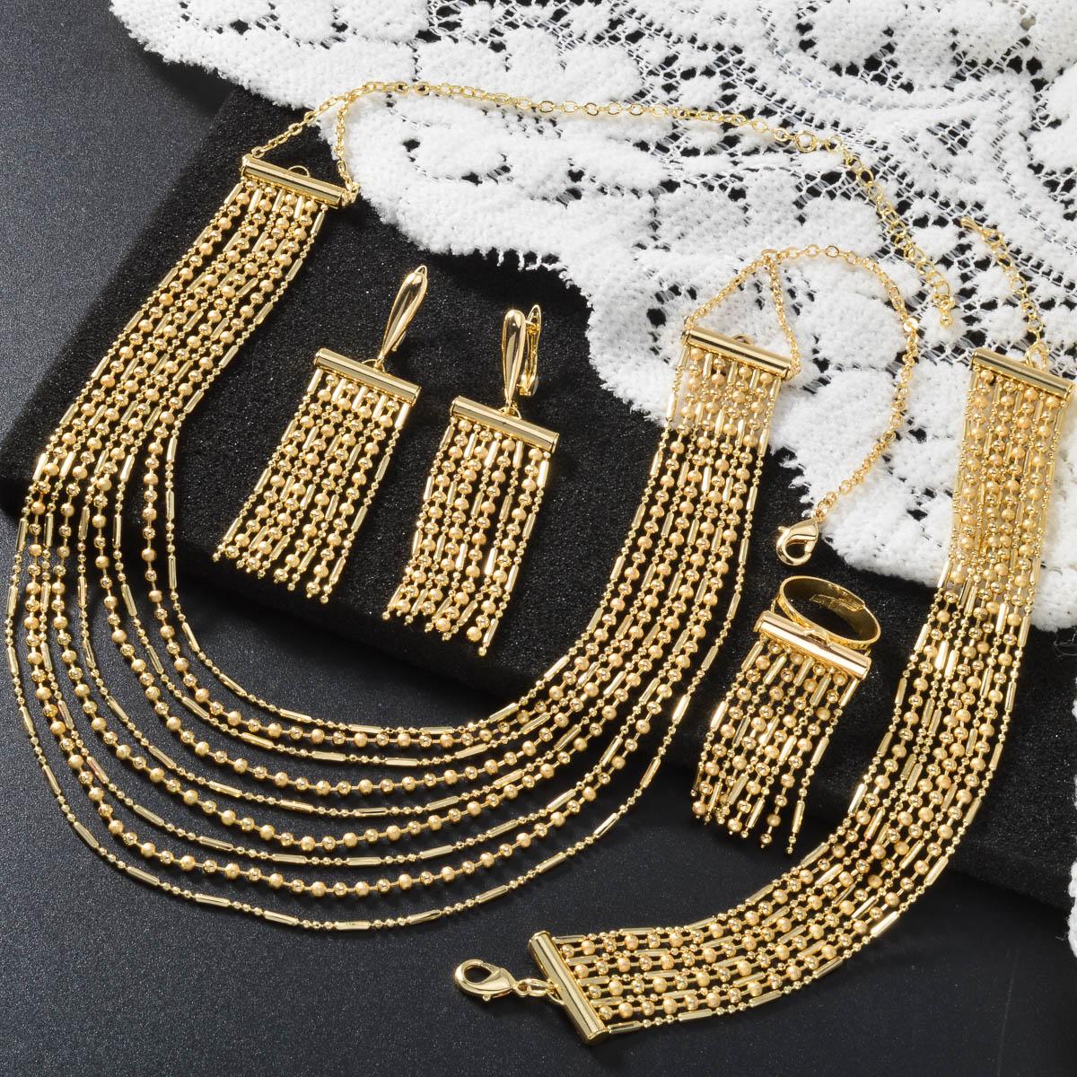 

Дубайский набор из четырех предметов с 18-каратным золотым покрытием: ожерелье, браслет, кольцо, серьги. Набор с многорядной цепочкой. Красивый свадебный набор для невесты. Подарки.
