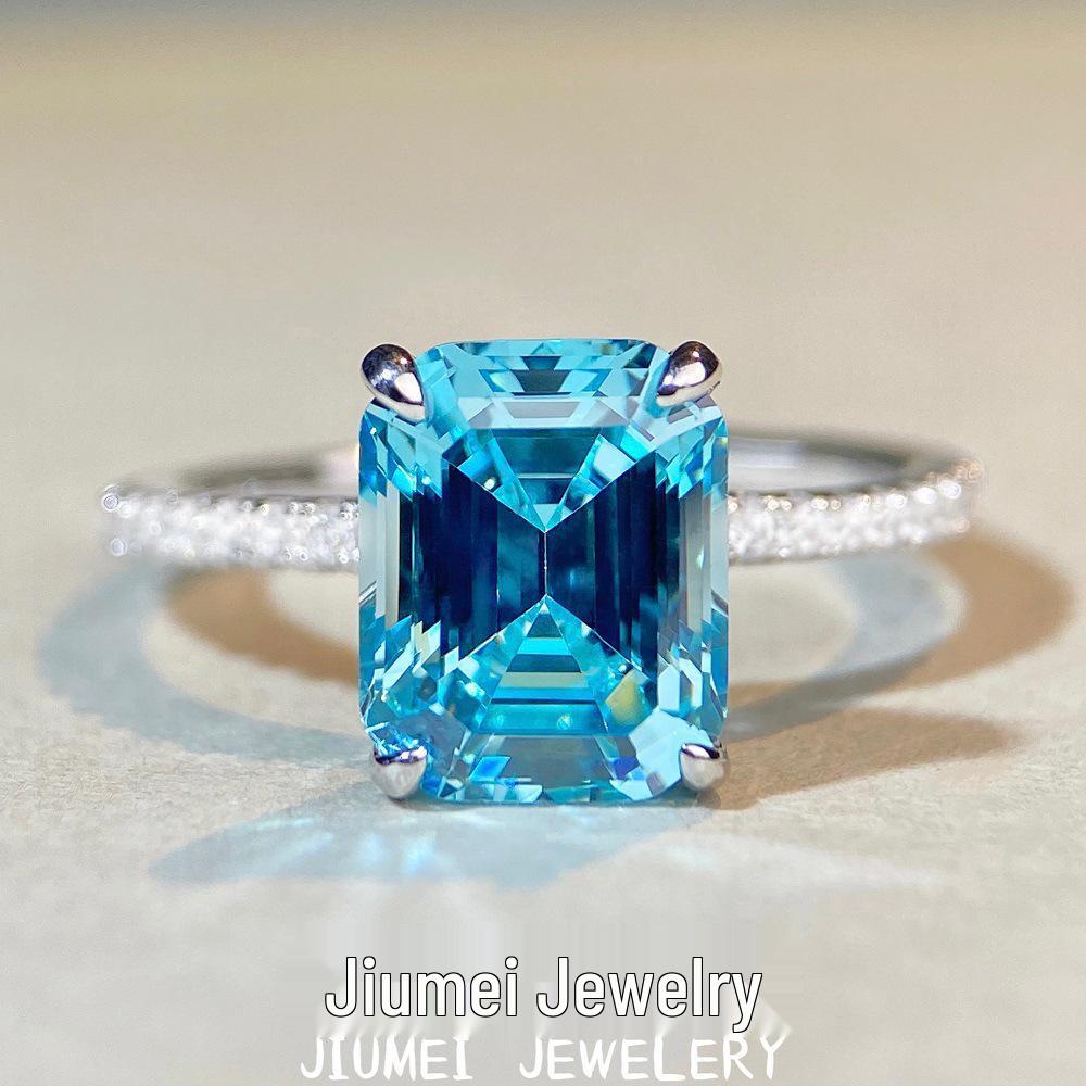 

Aquamarine Emerald-Cut Ring in 925 Sterling Silver with Pave Diamonds, Plated in PT950 Gold. Size 6