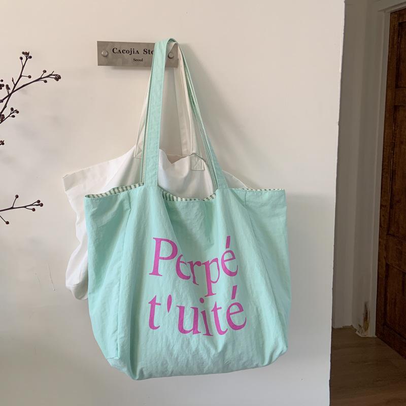 Korean dopamine nylon double-sided bag lazy wind striped color simple letter printed bag student commuter bag