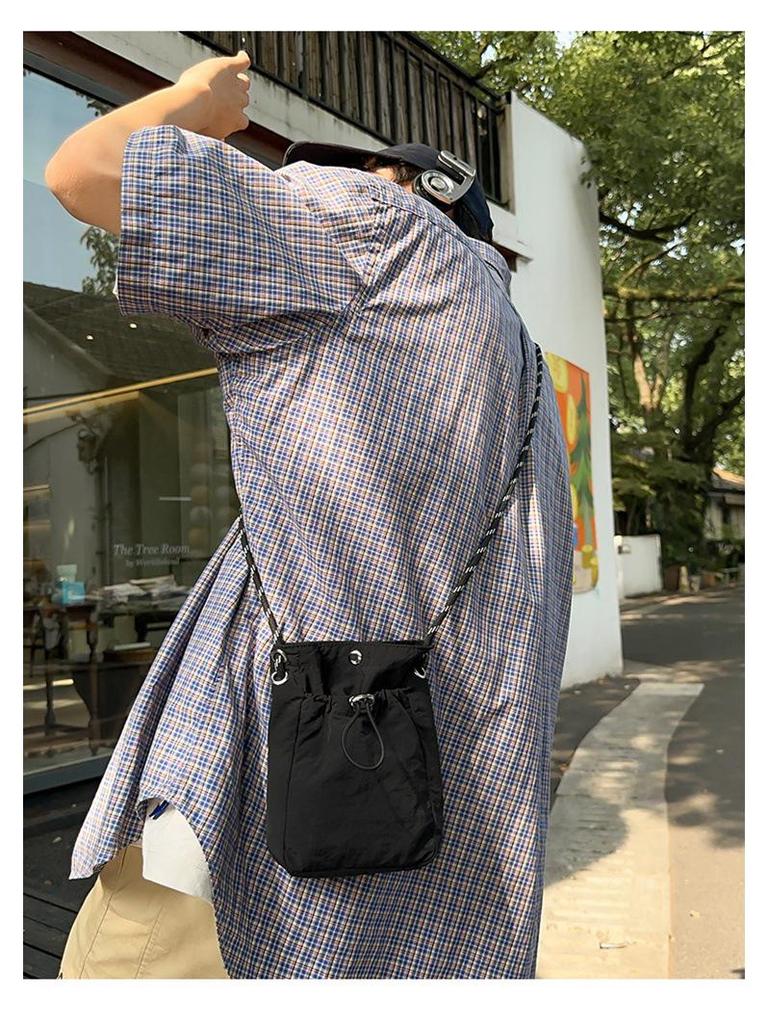 Stylish Crossbody Drawstring Bag: Trendy, Lightweight Cloth Phone Bag with Artistic Niche Design