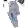 Men's Casual Jogging Pants with Drawstring Design, Made of Polyester Fabric, Featuring Printed Patterns, Perfect for Sports and Leisure Wear