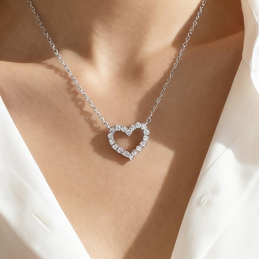 A Pendant Necklace for Women with a Rhinestone-embellished Hollow Heart Design for Valentine's Day