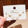 Set of 3 Full-Drilled White Flower Stud Earrings with Micro-Paved Cubic Zirconia and Versatile Silver Needle Design.