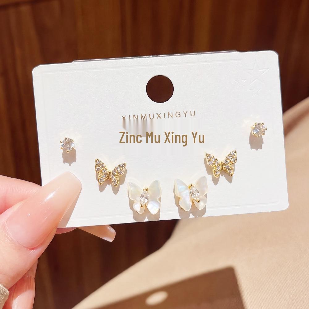 Set of 3 Full-Drilled White Flower Stud Earrings with Micro-Paved Cubic Zirconia and Versatile Silver Needle Design.
