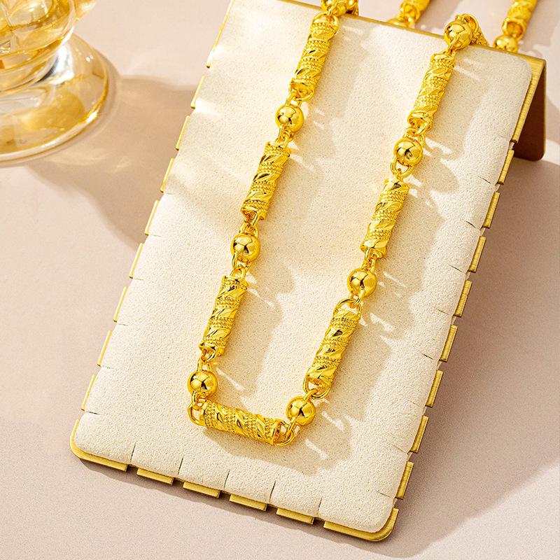 

Винтажное вьетнамское мужское ожерелье из песочного золота с бусиной и резным дизайном колонны - Долговечное сохранение цвета