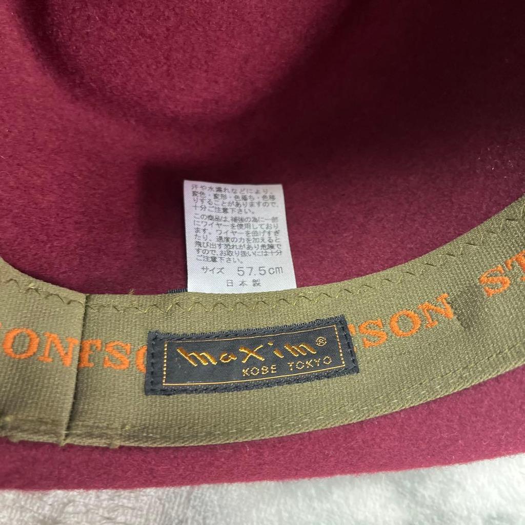 Used STETSON maxim burgundy wool hat with black ribbon and feather decoration