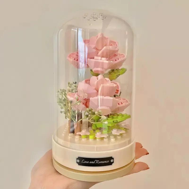 Building blocks music box Clockwork rotating music box Building blocks Rose Lily of the valley puzzle set Valentine's Day gift