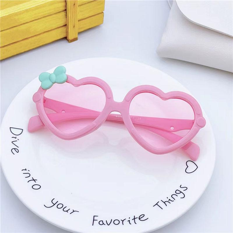 Neue Kinder-Sonnenbrille in Herzform Mädchen-Dekorative Schleife Sonnenbrille Niedliche Baby-Outdoor-Sonnenblende Brillen UV400