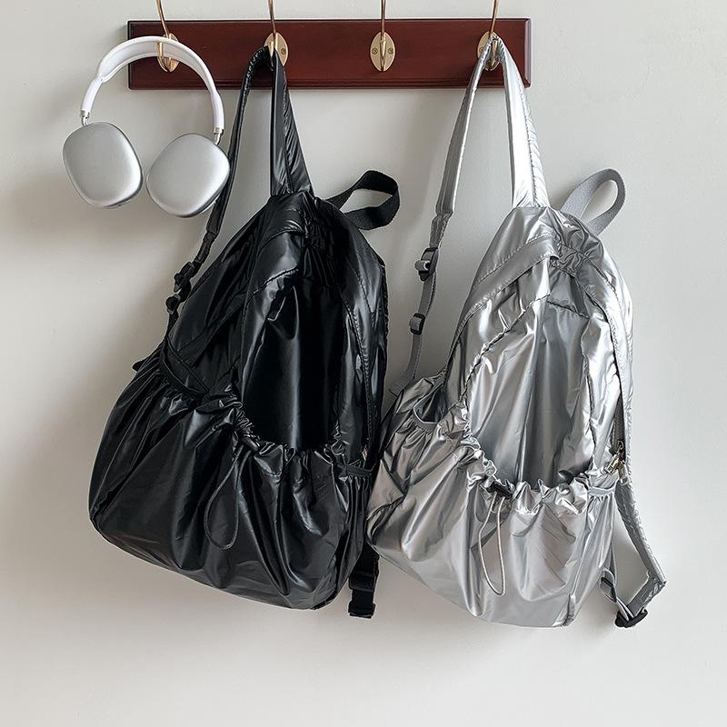 Sac à dos premium en cuir souple Argent Version coréenne Nouveau design de niche Grande capacité Tendance Sac à dos pour filles