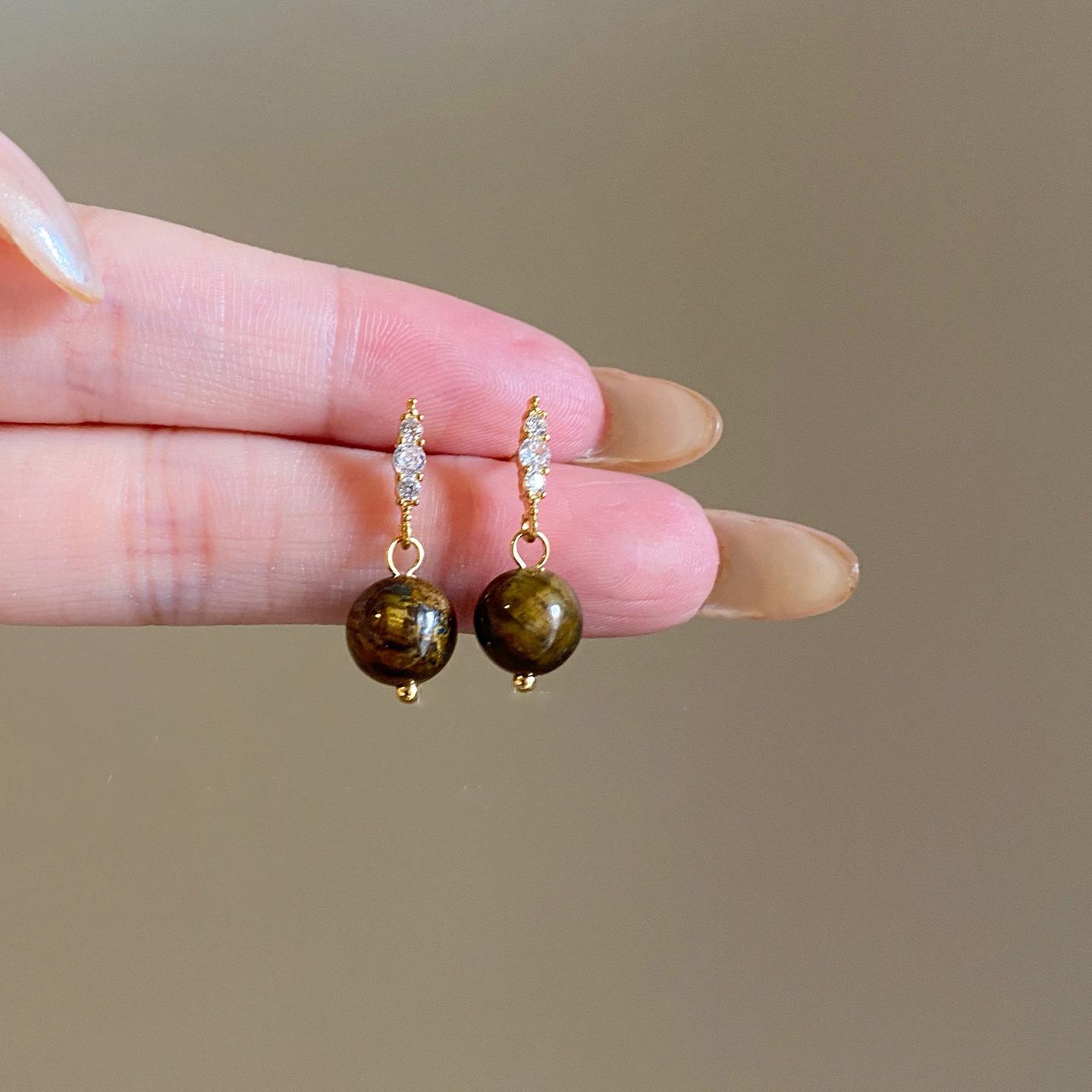 

Silver Needle Cubic Zirconia Tiger Eye Bow Earrings: Retro, Fashionable, High-End Water Drop Ear Studs