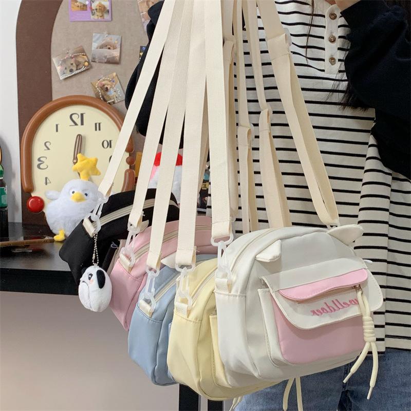 Small fresh and sweet contrasting color messenger bag women's spring new student shoulder bag personalized cat ears mobile phone small square bag