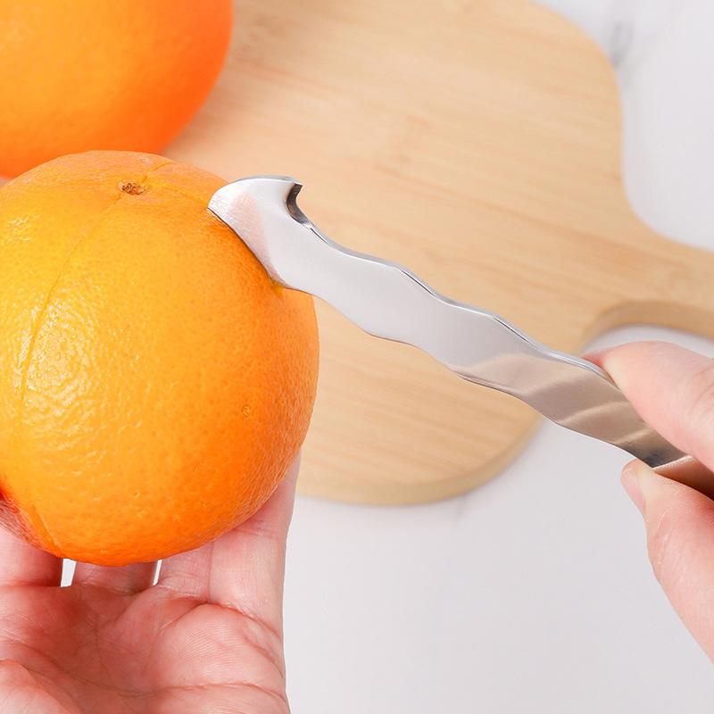 New Model Kitchen Appliance for Removing Peels From Fresh Fruits. Home-use Stainless Steel Device for Peeling Oranges and Grapefruits.