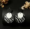 Elegant Leather Earrings with Geometric Zebra Print