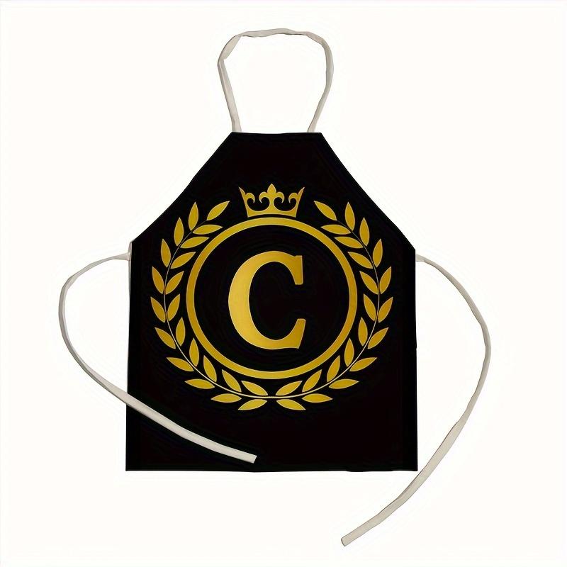 1 personalized letter apron with golden crown print on a black background, suitable for kitchen baking and barbecue