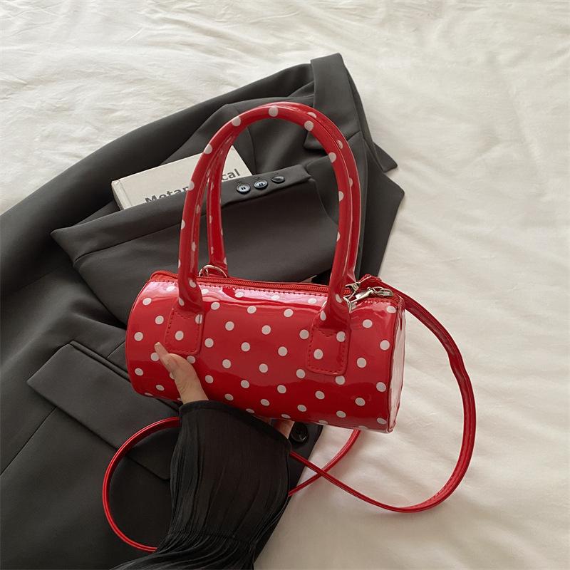 Niche polka dot bag women's 2025 bag new French retro underarm messenger bag exquisite portable women's bag cylindrical bag