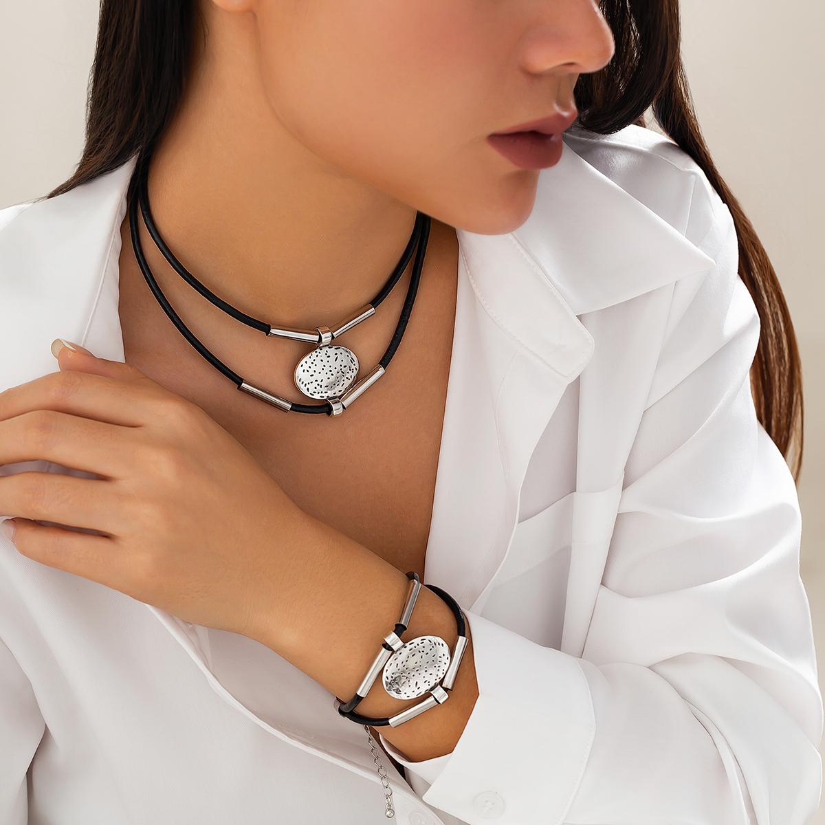 

Ingemark 2Pcs/Set Vintage Ethnic Oval Embossed Pendant Choker Necklace Bracelet Women Men Classic Black Rope Chain Jewelry Set