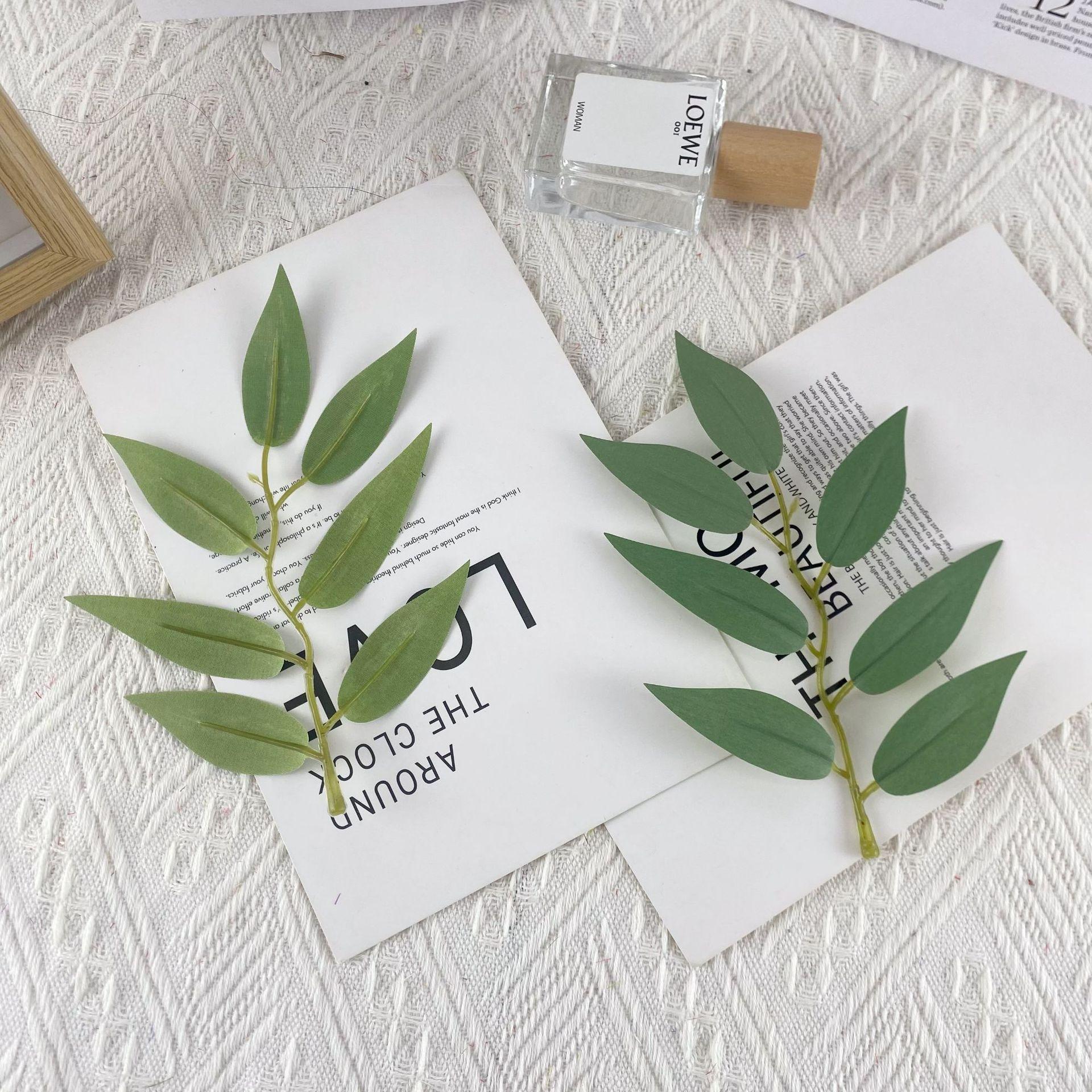 

Прямые продажи Имитация шелкографии 7 веток Ивовые листья Зеленые растения Аксессуары Настенная ручка Пучок Ландшафтное оформление Настенное украшение