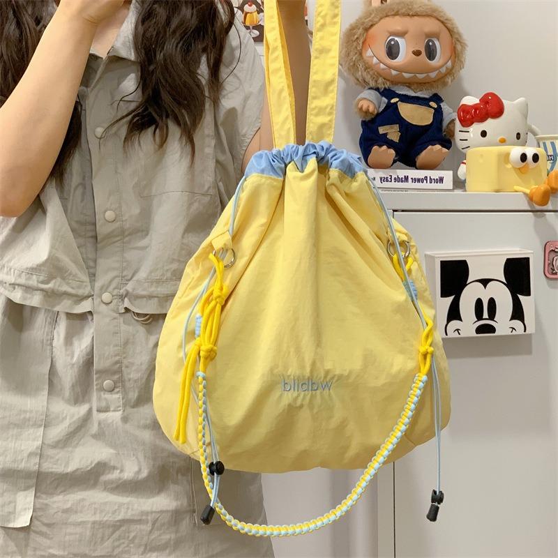 Niche Canvas Bag Color Matching Drawstring Adjustable Shoulder Strap Multi-function Hand Carry Contrasting Color Light Crossbody Shoulder Bag