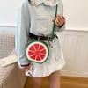 A Girl Carrying An Unconventional-shaped Bag Over Her Shoulder for Daily Commuting Purposes.