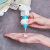 Body wash filled bag squeeze artifact suspended reverse hook lotion replace artifact bag press drain