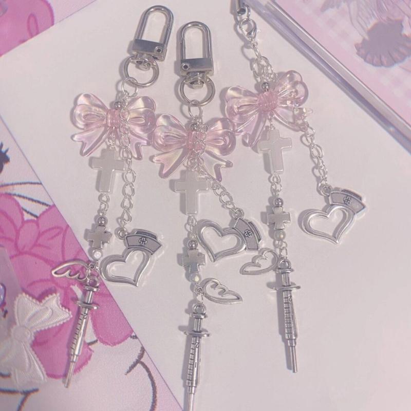 Niedlicher Spritze Schleife Kreuz Schlüsselanhänger Anhänger Tasche Handy Anhänger Damen Rucksack Handtasche Charme Reizende Hängedekoration