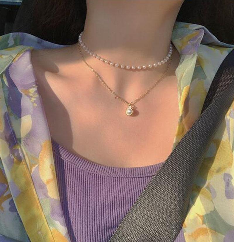 Feenhafte Perlenkette: Mehrlagige, vielseitige Schlüsselbeinkette für einen frischen, mädchenhaften Look.