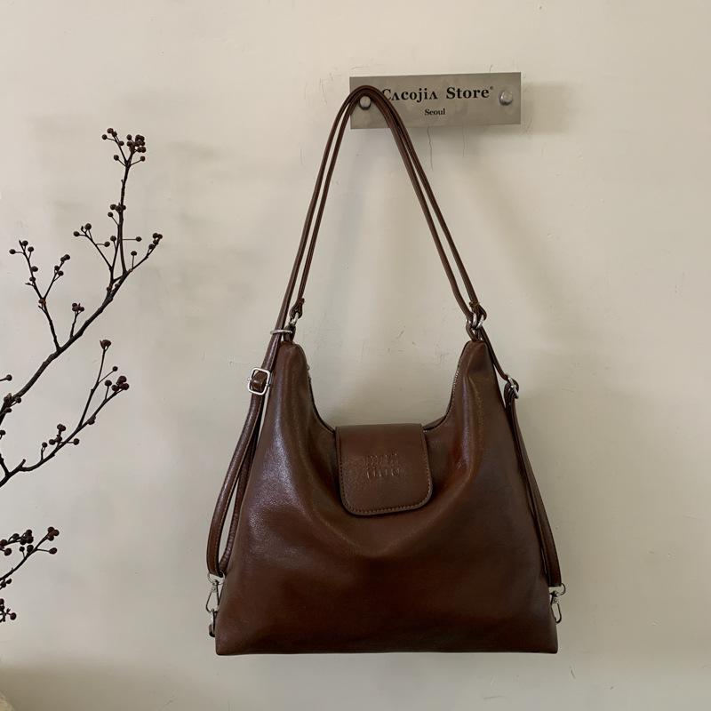 

Студенты колледжа ездят на занятия рюкзак женский большой вместимости 2025 новый простой повседневный высокоценный наплечный тоут кофейный