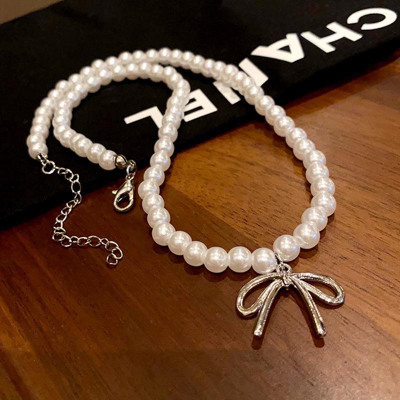 

Ожерелье-чокер в стиле ретро с жемчугом — простой, универсальный, элегантный дизайн