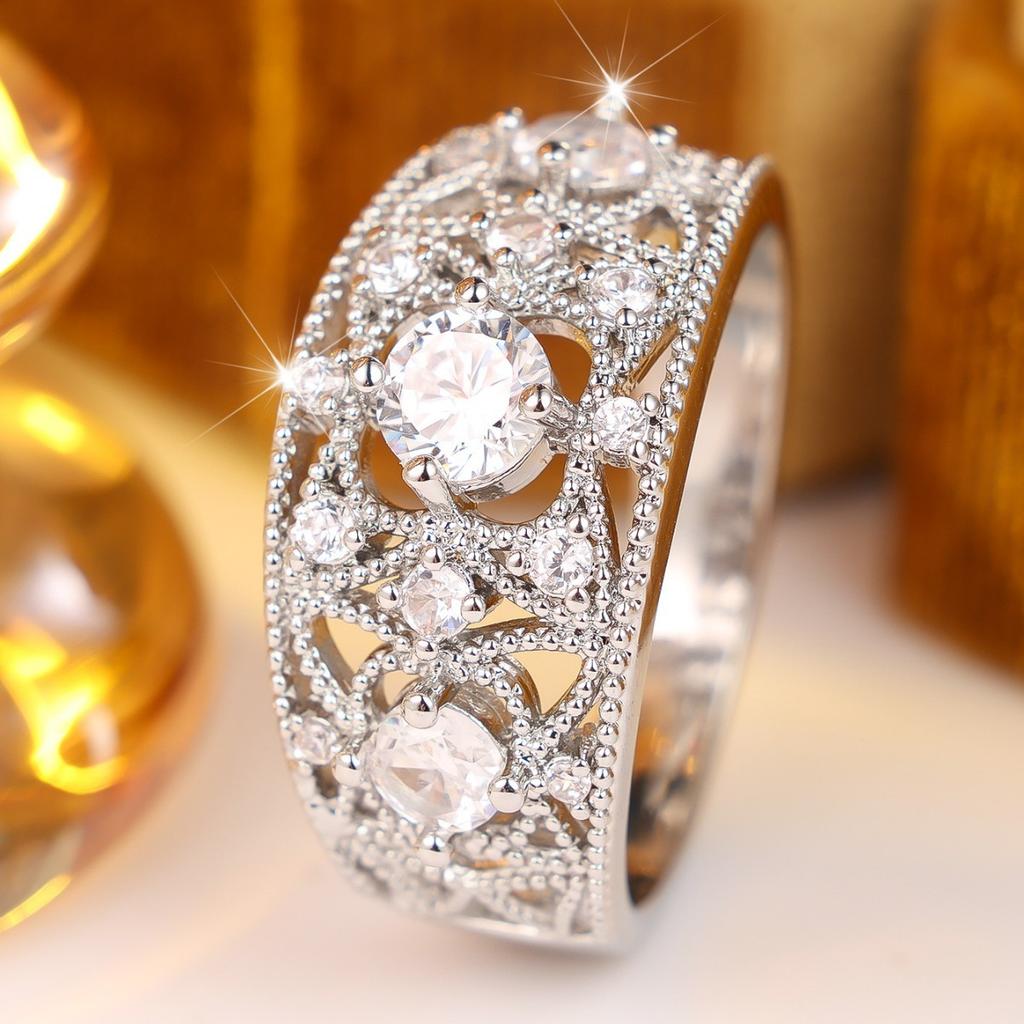 Heavy-duty, intricately carved, vine-patterned, wide ring with full diamond embellishments Light luxury, versatile, multi-layered ring with a central