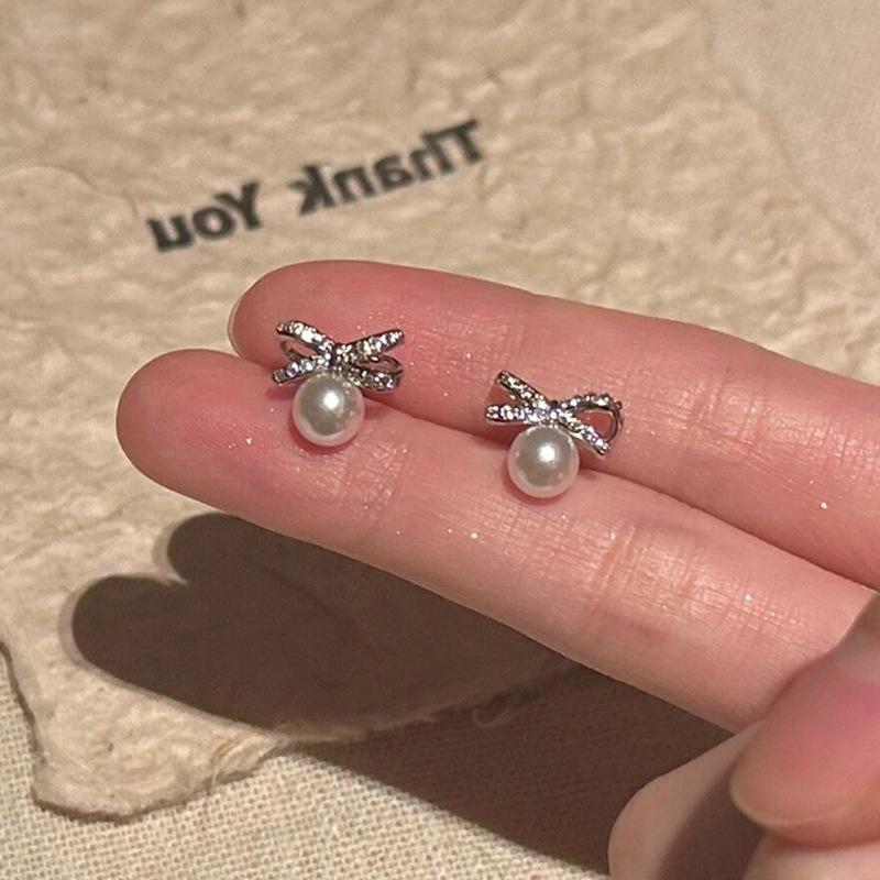 Elegant Zircon Pearl Bow Stud Earrings for Women: Luxurious, Unique, Minimalist, and Versatile.