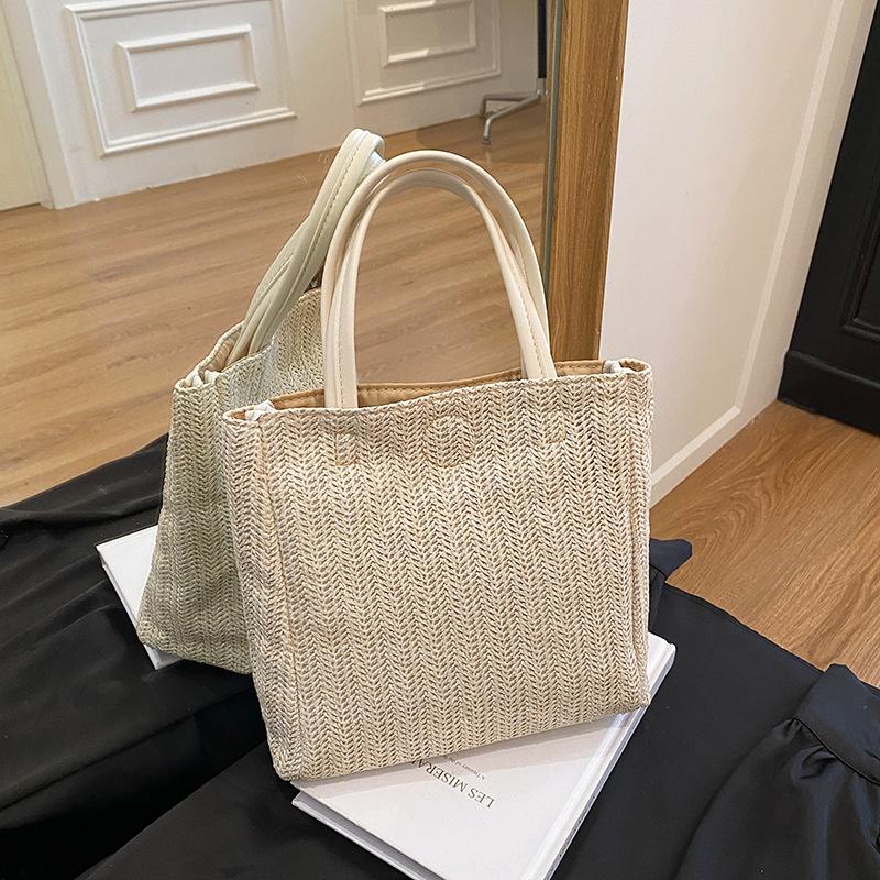 

Straw bag women s 2025 spring new large-capacity simple bucket bag beach woven contrasting color portable tote bag хаки