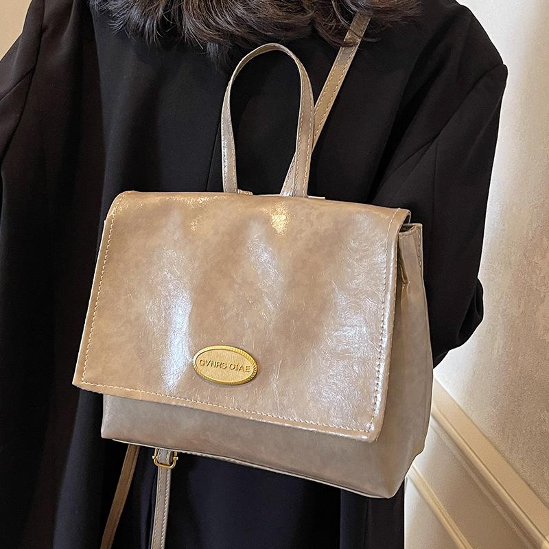 Koreanische Taschen für Damen im Herbst und Winter Neuer Retro Ölwachs Leder College Studenten Klassenrucksack Modische Handtaschen