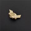 Gold plated alloy knot shaped brooch with neutral and cool style, fashionable and simple women's accessories