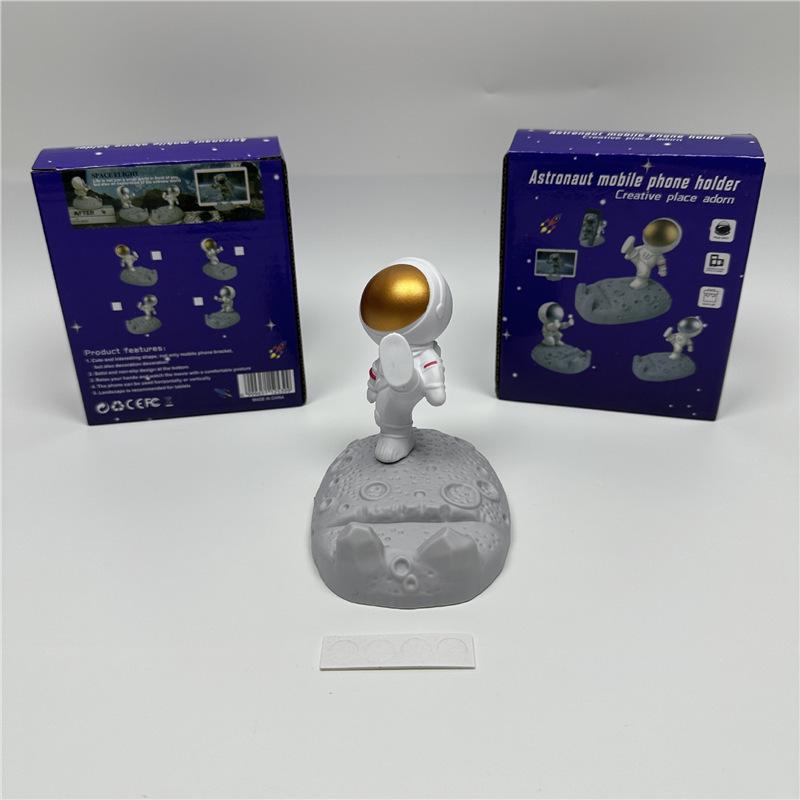 Astronaut Figurine Phone Holder: Creative Plastic Desktop Decor & Gift Standard