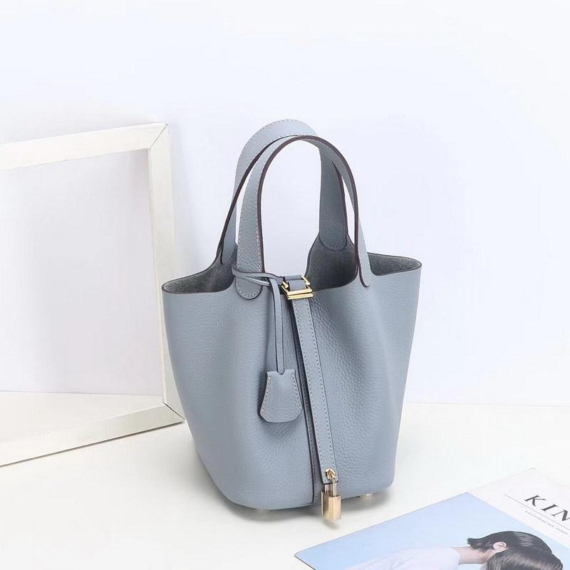 2026 new first-layer lychee pattern leather bucket bag European and American brand fashion gold buckle cowhide vegetable basket women's bag