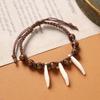 Retro Tibetan braided dog tooth bracelet handmade exotic personalized hand rope niche stacked wear men's and women's accessories