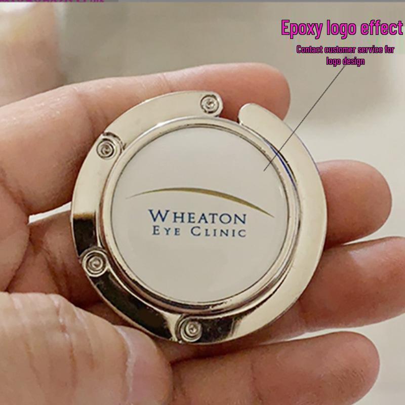 Tragbarer Faltbarer Handtaschenhaken - Kreatives Rundes Metall-Souvenir