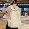 Design sense dopamine embroidery large capacity junior high school bag ins niche female high school student lightweight backpack