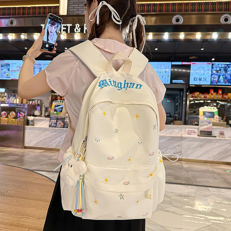 Design sense dopamine embroidery large capacity junior high school bag ins niche female high school student lightweight backpack