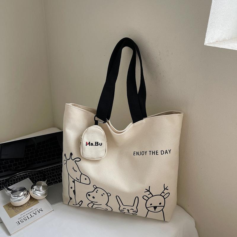2025 autumn new leisure commuter large-capacity canvas bag women's niche shoulder bag graffiti portable tote bag