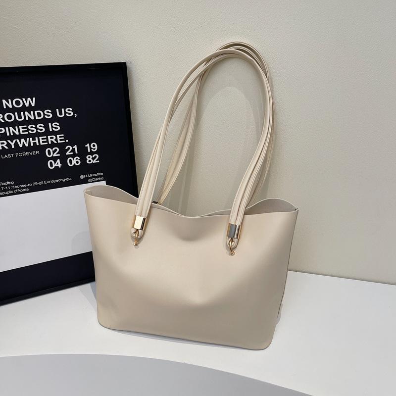 

Solid color literary and simple tote bag women s 2025 new trend casual versatile niche high-end shoulder bag