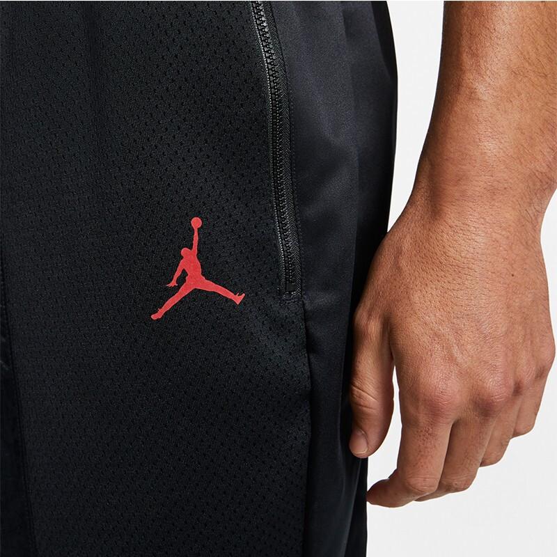 Jordan Pánské zúžené červené tepláky s logem Jumpman Černé AV1306-010