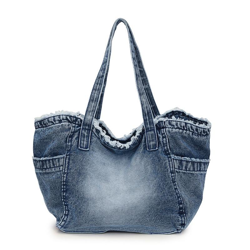 

Large capacity bag new casual bag high sense versatile shoulder fashion women s underarm canvas bag trend джинсовий синього кольору