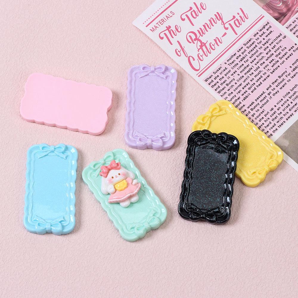 Tegneseriesløyfemønster harpiksplate for DIY hårnål og magnetlaging