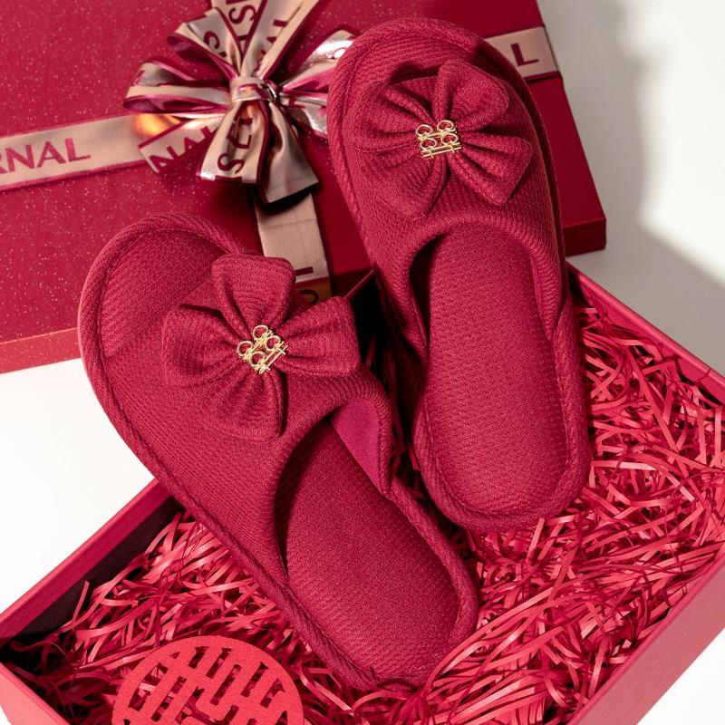 A pair of red wedding slippers autumn and winter light luxury newlyweds festive wedding bride dowry slippers groom
