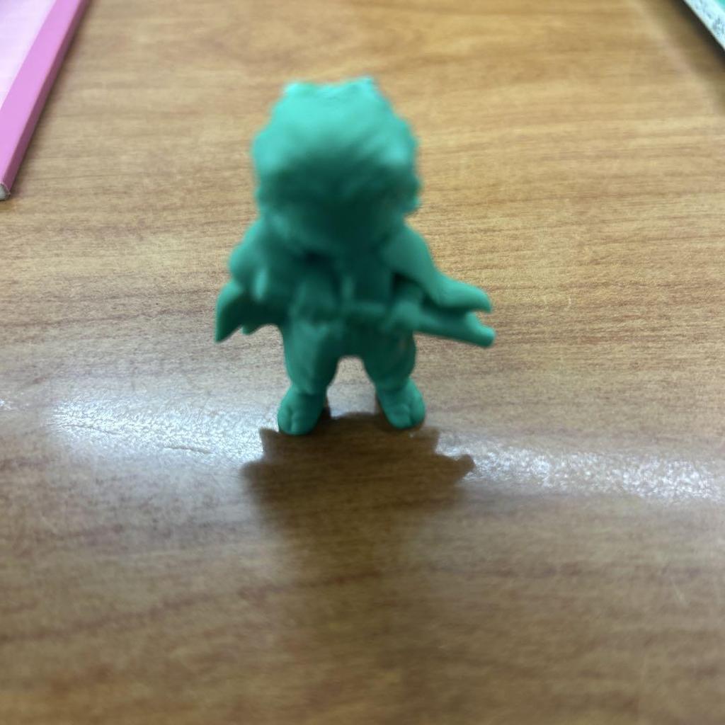 [USED] A small figurine with a green sword