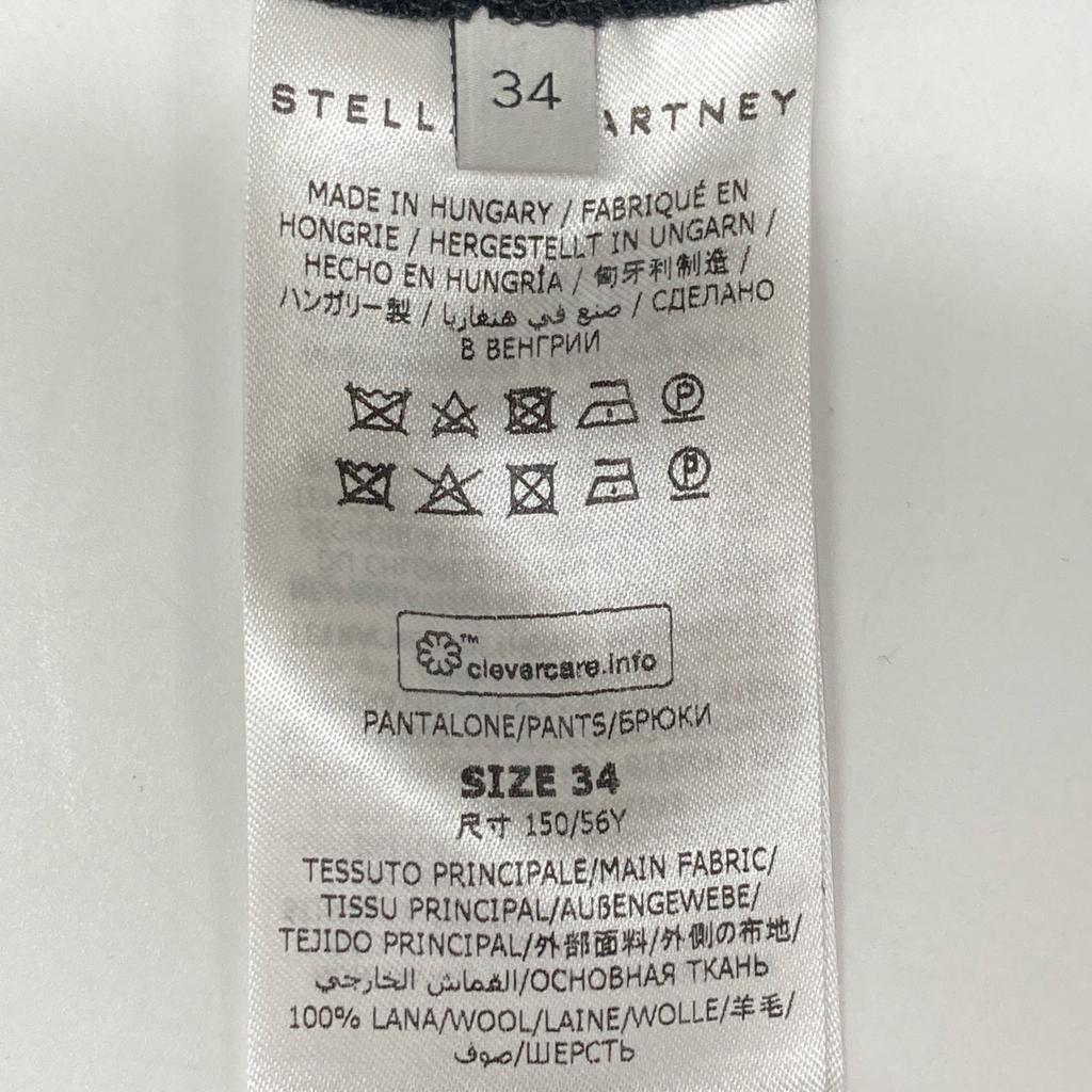 Stella Mccartney 531844 Svarte ullbukser med sidesglidelås, senterfold og avsmalnende ben Deler 34 svartBrukt