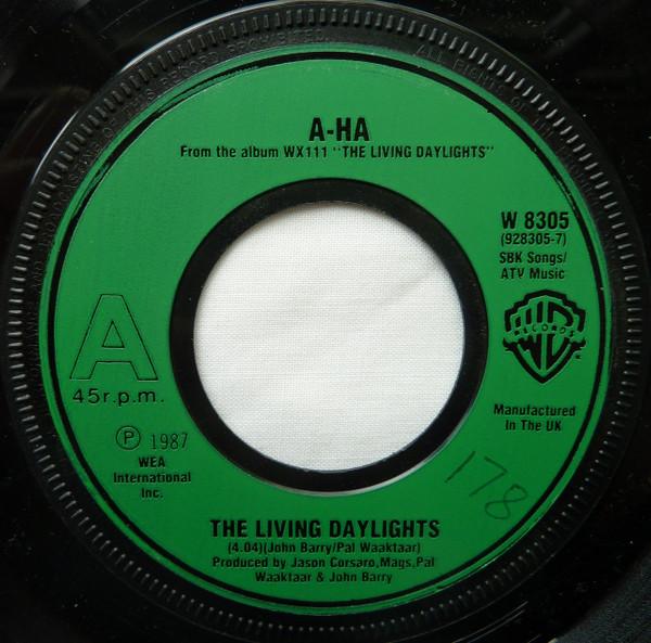

7inch Record AHA The Living Daylights W8305 Warner Bros. Re 1987 UK Pop Used