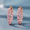 A Set of Hoop Earrings Plated With, Featuring Pink Cubic Zirconia and Round Synthetic Stones, Made of Copper. Perfect for Women