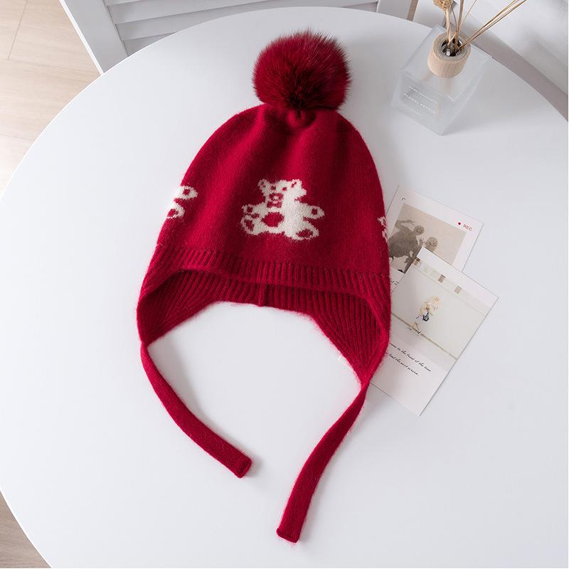 Autumn and winter children's cashmere fur ball jacquard warm knitted ear protection cashmere hat spot can be customized